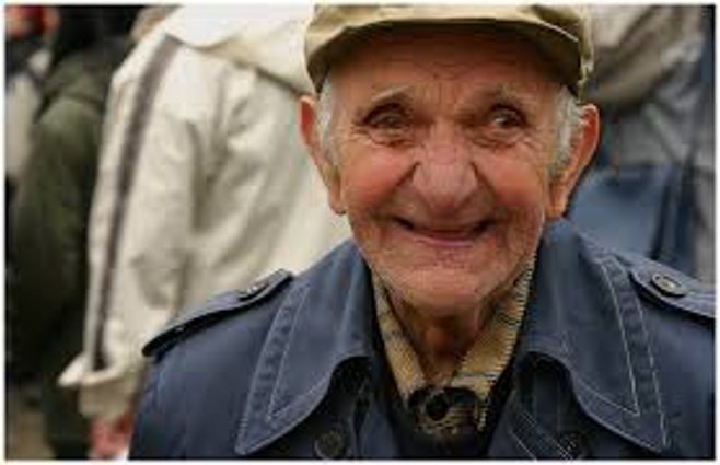 old man with hat smiling 
